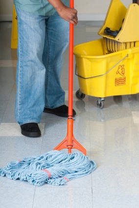 Blue Dive Pro Cleaning LLC janitor in Eatonton, GA mopping floor.